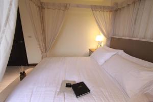 Postel nebo postele na pokoji v ubytování Yuncourt B&B