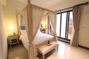 Postel nebo postele na pokoji v ubytování Yuncourt B&B