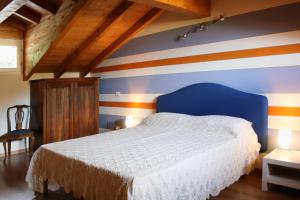 Postel nebo postele na pokoji v ubytování Cascina nel Bosco