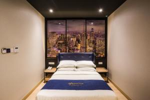 Postel nebo postele na pokoji v ubytování Manhattan Business Hotel TTDI