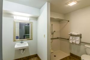 a bathroom with a shower and a sink and a toilet at Blue Bonnet Suites -Lubbock, TX - Medical Center in Lubbock +40 photos