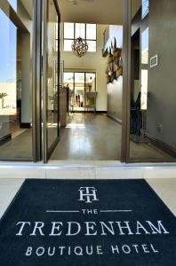 a rug that says the redrian boutique hotel on a hallway at Tredenham Boutique Hotel in Bloemfontein