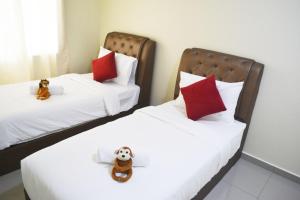 Katil atau katil-katil dalam bilik di Holidays Vacation Suite