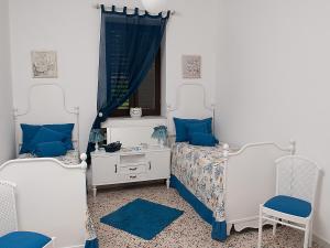 Cama ou camas em um quarto em Cefalù Caldura house