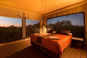 Säng eller sängar i ett rum på Eco Beach Wilderness Retreat