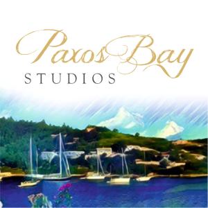 a sign that says fazos bay studios with boats in the water at Paxos Bay Studios in Gaios