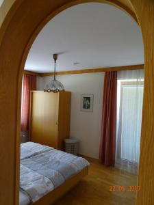 Una cama o camas en una habitación de Apartment Komar