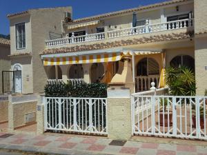 a house with a white gate and a balcony at Apartment 241 in Gran Alacant