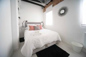 Una cama o camas en una habitación de Premium Piso Loft de 3 habitaciones en centro histórico