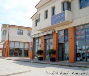 a building on the side of a street at Marine House Andrianna -Adults only in Siviri