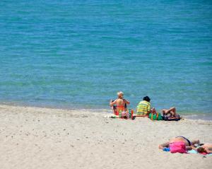 a group of people playing on the beach at Marine House Andrianna -Adults only in Siviri