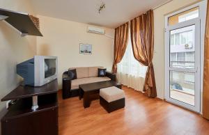 TV a/nebo společenská místnost v ubytování Guest House Oasis + 3 fotografie
