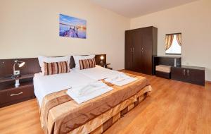 Postel nebo postele na pokoji v ubytování Guest House Oasis
