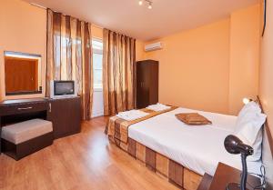 Postel nebo postele na pokoji v ubytování Guest House Oasis
