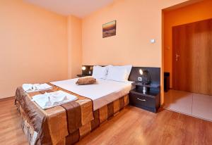 Postel nebo postele na pokoji v ubytování Guest House Oasis