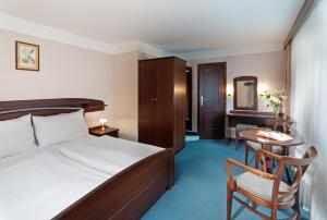 Postel nebo postele na pokoji v ubytování Hotel Zátiší