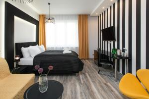 Posteľ alebo postele v izbe v ubytovaní Leo Apartments Old Town
