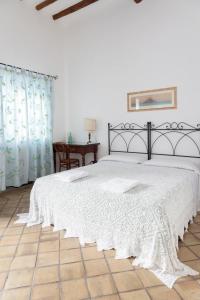 Postel nebo postele na pokoji v ubytování Hotel Mercanti di Mare