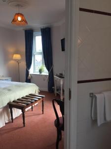 Postel nebo postele na pokoji v ubytování O Donovans Hotel