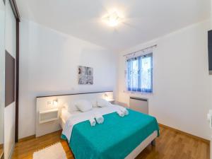 Cama o camas de una habitación en Apartments Dalmatia