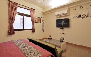 TV a/nebo společenská místnost v ubytování Redbean Guesthouse