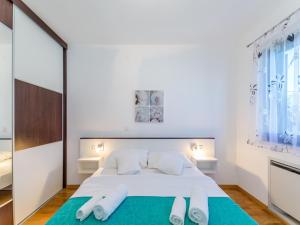 Un ou plusieurs lits dans un hébergement de l'établissement Apartments Dalmatia