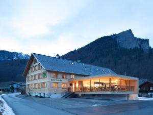 a large building with a lot of windows at Hotel Tannahof in Au im Bregenzerwald