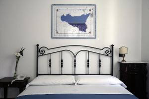 Postel nebo postele na pokoji v ubytování Hotel Mercanti di Mare