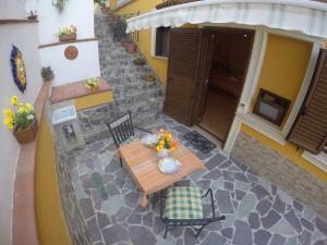an overhead view of a table and chairs on a patio at Residenza Eolo in Tropea +45 photos