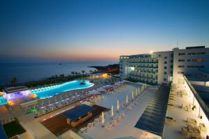 a view of a resort with a swimming pool at King Evelthon Beach Hotel & Resort in Paphos