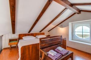 Postel nebo postele na pokoji v ubytování Hilltop Apartment Vidovici