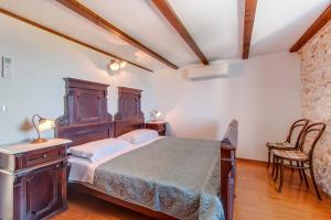 Postel nebo postele na pokoji v ubytování Hilltop Apartment Vidovici