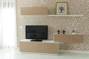 a living room with a flat screen tv on a stand at Apartment Light De Luxe - with Old Bridge view in Mostar