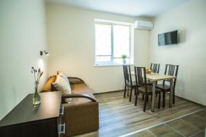 a living room with a couch and a table at Apartments on Leva st. in Berehove