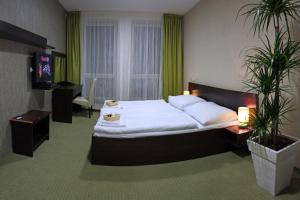 Posteľ alebo postele v izbe v ubytovaní Penzion Luxury + 17 fotografií