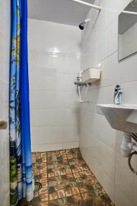 a bathroom with a shower curtain and a sink at Retro Moscow on Kurskaya in Moscow