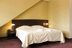 Posteľ alebo postele v izbe v ubytovaní Hotel Monet & Rubbens