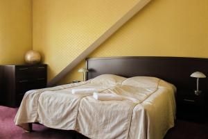 Posteľ alebo postele v izbe v ubytovaní Hotel Monet & Rubbens