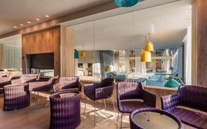 TV a/nebo společenská místnost v ubytování Schenna Resort