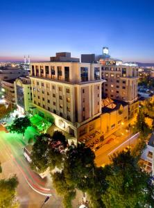 an overhead view of a building in a city at night at Tugcan Hotel in Gaziantep