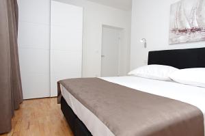 Posteľ alebo postele v izbe v ubytovaní Besker Apartment