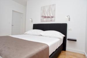 Posteľ alebo postele v izbe v ubytovaní Besker Apartment