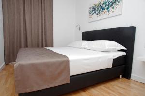 Posteľ alebo postele v izbe v ubytovaní Besker Apartment