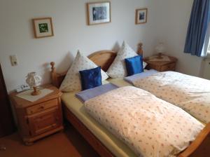 Ένα ή περισσότερα κρεβάτια σε δωμάτιο στο Ferienwohnungen Hölzl