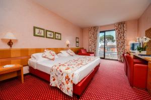 Posteľ alebo postele v izbe v ubytovaní Hotel Oliveto