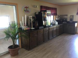 a kitchen with a counter with a coffee maker at Super 8 by Wyndham Hillsville in Hillsville