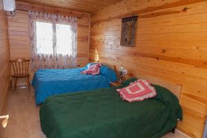 A bed or beds in a room at Casa Rural los Caños