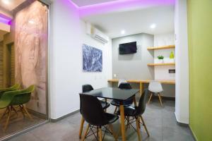 TV a/nebo společenská místnost v ubytování Hotel Suites Regina