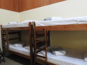 
A bunk bed or bunk beds in a room at Rio Celeste Backpackers
