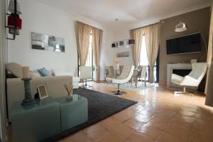 a living room with a couch and a table at boutique apartment al duomo in Salerno